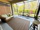 Enclosed patio with comfortable seating, area rug, and view to the outdoors at 6077 Amberly Dr, Bradenton, FL 34208