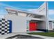 Close up of building's architectural detail with a red door entrance at 8100 Ciboney Ct # 9, Sarasota, FL 34240