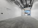 Spacious interior featuring high ceilings, bright lighting, and a concrete floor at 8100 Ciboney Ct # 9, Sarasota, FL 34240
