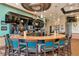 An inviting bar area features a stylish stone countertop and comfortable seating at 8402 Grand Estuary Trl # 101, Bradenton, FL 34212