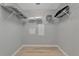 Walk-in closet features white wire shelving and ample storage space at 8402 Grand Estuary Trl # 101, Bradenton, FL 34212