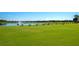 Picturesque golf course view with lush green fairways and serene lake features at 8402 Grand Estuary Trl # 101, Bradenton, FL 34212