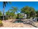 A relaxing hot tub surrounded by lush greenery and comfortable lounge chairs at 8402 Grand Estuary Trl # 101, Bradenton, FL 34212