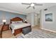 Inviting main bedroom with wooden furniture, including a king-size bed and a cool-toned rug, perfect for relaxation at 8402 Grand Estuary Trl # 101, Bradenton, FL 34212