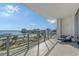 Spacious balcony featuring city and waterfront views, with lounge chair at 1155 N Gulfstream Ave # 607, Sarasota, FL 34236