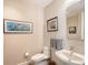 Powder room featuring an elongated toilet and vanity at 1155 N Gulfstream Ave # 607, Sarasota, FL 34236