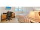 Bright bedroom with a bed, desk, chair and a TV at 1155 N Gulfstream Ave # 607, Sarasota, FL 34236