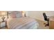 Bedroom featuring a bed, desk, and two bedside tables at 1155 N Gulfstream Ave # 607, Sarasota, FL 34236