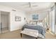 Bright bedroom featuring a large window and comfortable furnishings at 1155 N Gulfstream Ave # 607, Sarasota, FL 34236