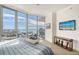 Serene bedroom featuring floor-to-ceiling windows with water views at 1155 N Gulfstream Ave # 607, Sarasota, FL 34236