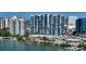 Modern high-rise condo building featuring sleek architectural lines, glass balconies, and stunning waterfront views at 1155 N Gulfstream Ave # 607, Sarasota, FL 34236