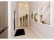 Hallway with unique lighting, art and an elevator at 1155 N Gulfstream Ave # 607, Sarasota, FL 34236