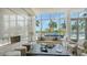 Bright living room featuring floor-to-ceiling windows and modern fireplace with scenic views at 1155 N Gulfstream Ave # 607, Sarasota, FL 34236