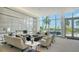 Bright living room boasts modern fireplace, floor-to-ceiling windows offering scenic views at 1155 N Gulfstream Ave # 607, Sarasota, FL 34236