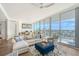 Bright living room featuring floor to ceiling windows with expansive city and water views and hardwood flooring at 1155 N Gulfstream Ave # 607, Sarasota, FL 34236