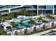 Aerial view of the pool area featuring lounge chairs and palm trees at 1155 N Gulfstream Ave # 607, Sarasota, FL 34236
