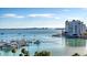 Scenic waterfront view featuring docked yachts, surrounding buildings, and horizon at 1155 N Gulfstream Ave # 607, Sarasota, FL 34236