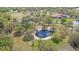 Gorgeous acreage with a serene pond surrounded by mature trees at 12001 Backwater Rd, Sarasota, FL 34240