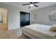 Bedroom featuring a large closet, neutral colors, and ample light from two windows at 12001 Backwater Rd, Sarasota, FL 34240