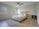 This main bedroom features a plush bed, stylish nightstands and lots of natural light at 12001 Backwater Rd, Sarasota, FL 34240