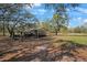 An outdoor chicken coop with a shaded area for chickens to roam at 12001 Backwater Rd, Sarasota, FL 34240