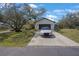 Two-story home with a large front yard and long driveway at 12001 Backwater Rd, Sarasota, FL 34240