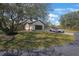 Two-story home with a dark garage door and well-maintained lawn at 12001 Backwater Rd, Sarasota, FL 34240
