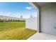 Spacious backyard featuring lush green lawn, vinyl fence and privacy landscaping at 16606 San Nicola Pl, Lakewood Ranch, FL 34211