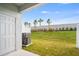 Spacious backyard featuring lush green lawn, vinyl fence and privacy landscaping at 16606 San Nicola Pl, Lakewood Ranch, FL 34211