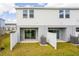 Townhouse backyards with private patios, green lawns, and partial fencing at 16606 San Nicola Pl, Lakewood Ranch, FL 34211
