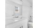 Clean bathroom vanity with modern fixtures and a large mirror at 16606 San Nicola Pl, Lakewood Ranch, FL 34211