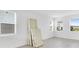 Bright bedroom featuring natural light from two windows with blinds at 16606 San Nicola Pl, Lakewood Ranch, FL 34211