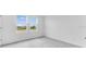 Bright bedroom with two windows overlooking a green lawn at 16606 San Nicola Pl, Lakewood Ranch, FL 34211