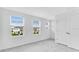 Bright bedroom with carpet, three windows providing lots of natural light, and double doors at 16606 San Nicola Pl, Lakewood Ranch, FL 34211