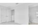 Bright bedroom featuring access to bathroom and closet with double doors at 16606 San Nicola Pl, Lakewood Ranch, FL 34211