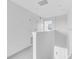 Bright hallway with neutral carpeting, lots of light and staircase to lower level at 16606 San Nicola Pl, Lakewood Ranch, FL 34211