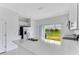 Bright, modern kitchen with white cabinets, stainless appliances, and a view of the backyard at 16606 San Nicola Pl, Lakewood Ranch, FL 34211