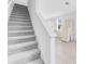 Carpeted staircase leading to a bright upper level, doors stacked in the corner at 16606 San Nicola Pl, Lakewood Ranch, FL 34211