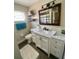 Charming bathroom with vanity, marble countertops, modern fixtures, and ample lighting at 241 Seminole Nw Blvd, Port Charlotte, FL 33952