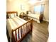 Cozy bedroom with twin beds, wood frames, hardwood floors and natural light at 241 Seminole Nw Blvd, Port Charlotte, FL 33952