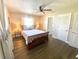 Cozy bedroom with neutral colors, hardwood floors, and natural light at 241 Seminole Nw Blvd, Port Charlotte, FL 33952