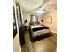 Serene bedroom with dark accents, comfortable bedding, and stylish decor at 241 Seminole Nw Blvd, Port Charlotte, FL 33952