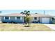 Charming single-story home with a well-maintained lawn, stone accents, and an attached garage at 241 Seminole Nw Blvd, Port Charlotte, FL 33952