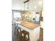 Charming kitchen with granite countertops, island seating, and stainless steel appliances at 241 Seminole Nw Blvd, Port Charlotte, FL 33952