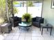Relaxing sunroom with wicker furniture, a glass table, and views of the outdoor space at 241 Seminole Nw Blvd, Port Charlotte, FL 33952