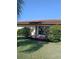 Private patio entrance surrounded by vibrant foliage in landscaped backyard at 3314 Mcdill Rd # 3314, Bradenton, FL 34207