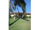 Well-kept backyard featuring lush lawn and tropical landscaping at 3314 Mcdill Rd # 3314, Bradenton, FL 34207