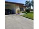 Lovely front exterior with green grass, landscaping, and car port at 3314 Mcdill Rd # 3314, Bradenton, FL 34207
