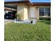 Charming front exterior of a home with manicured lawn and a car port at 3314 Mcdill Rd # 3314, Bradenton, FL 34207