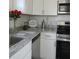 Renovated kitchen showcasing granite countertops and stainless steel appliances at 3314 Mcdill Rd # 3314, Bradenton, FL 34207